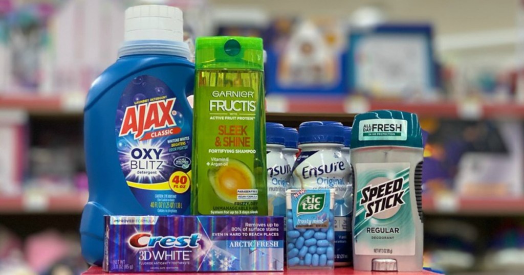 laundry detergent, shampoo, toothpaste, mints, nutritional shakes, and deodorant on a shelf in a store