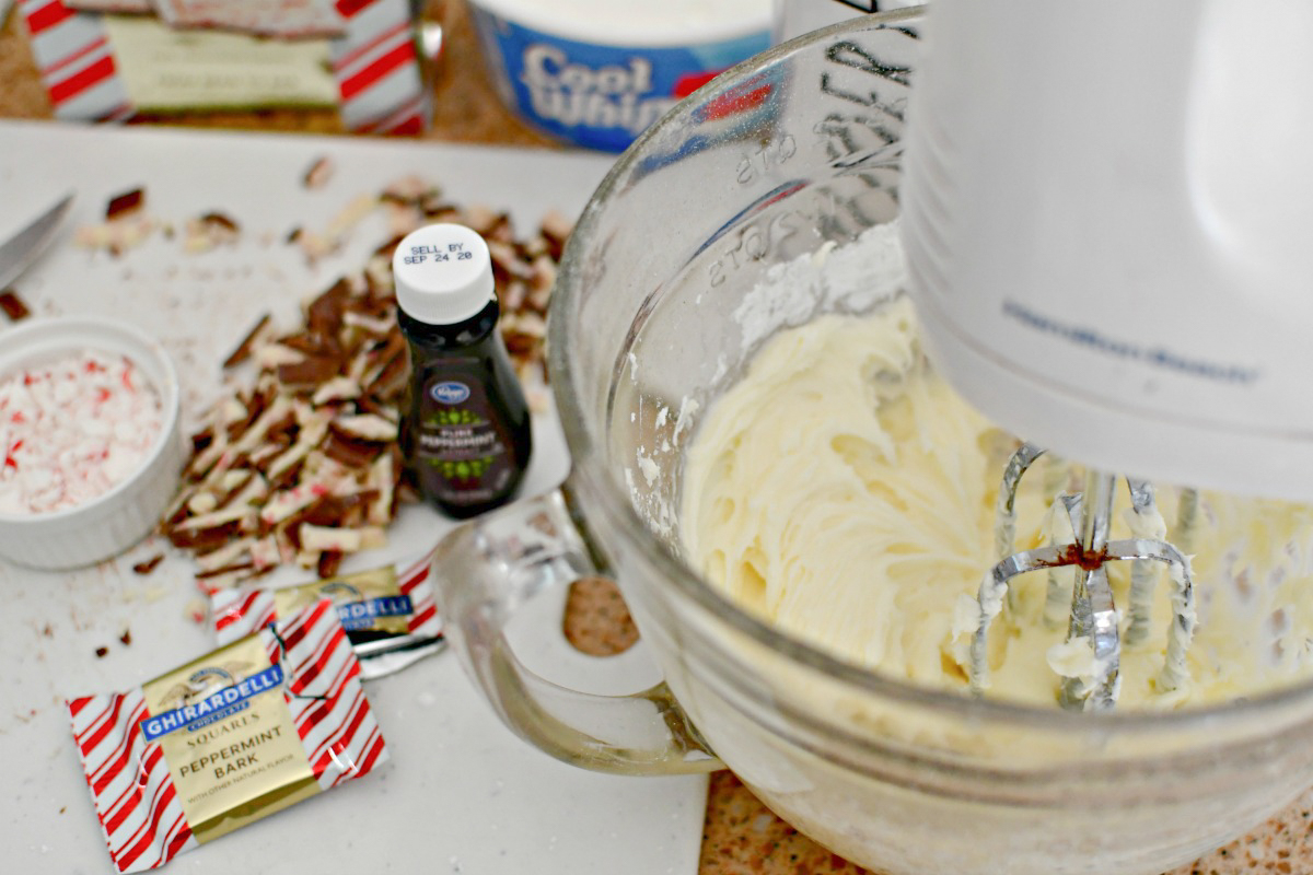 whipping up peppermint bark dip with a mixer 