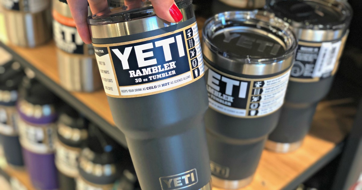 hand holding gray yeti tumbler in the store