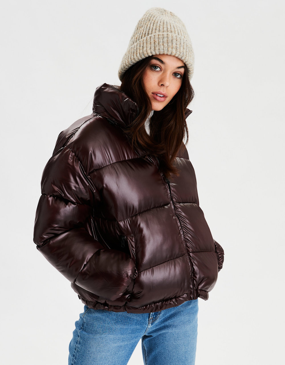 Woman wearing beanie and American Eagle Puffer Coat