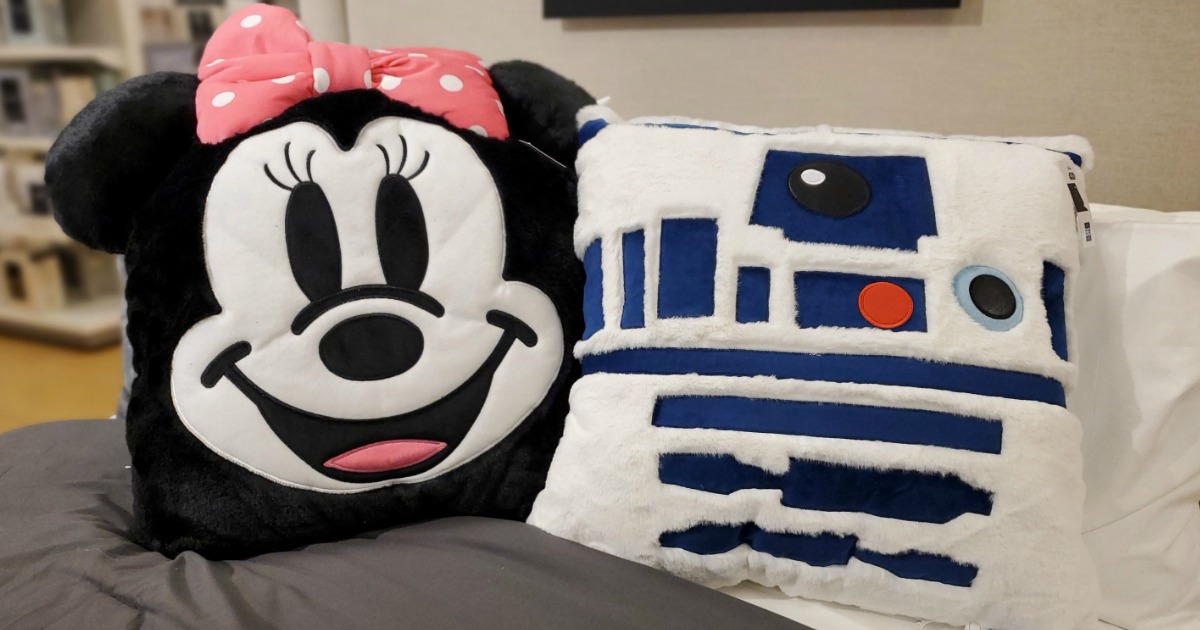 Disney The Big One Critter Pillows sitting on a bed