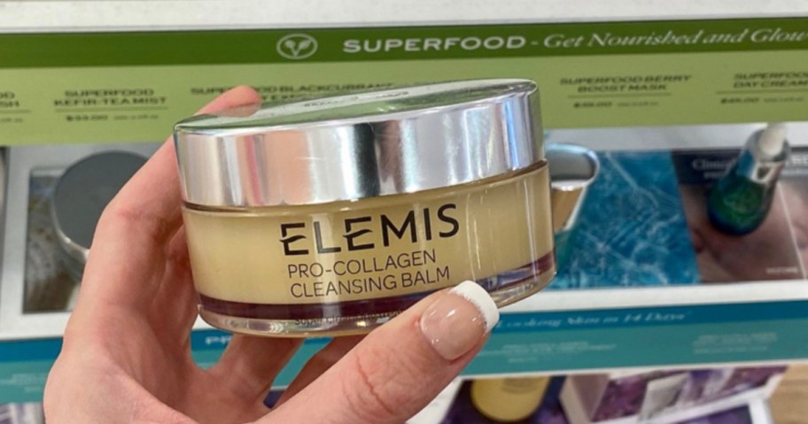 holding elemis jar in store