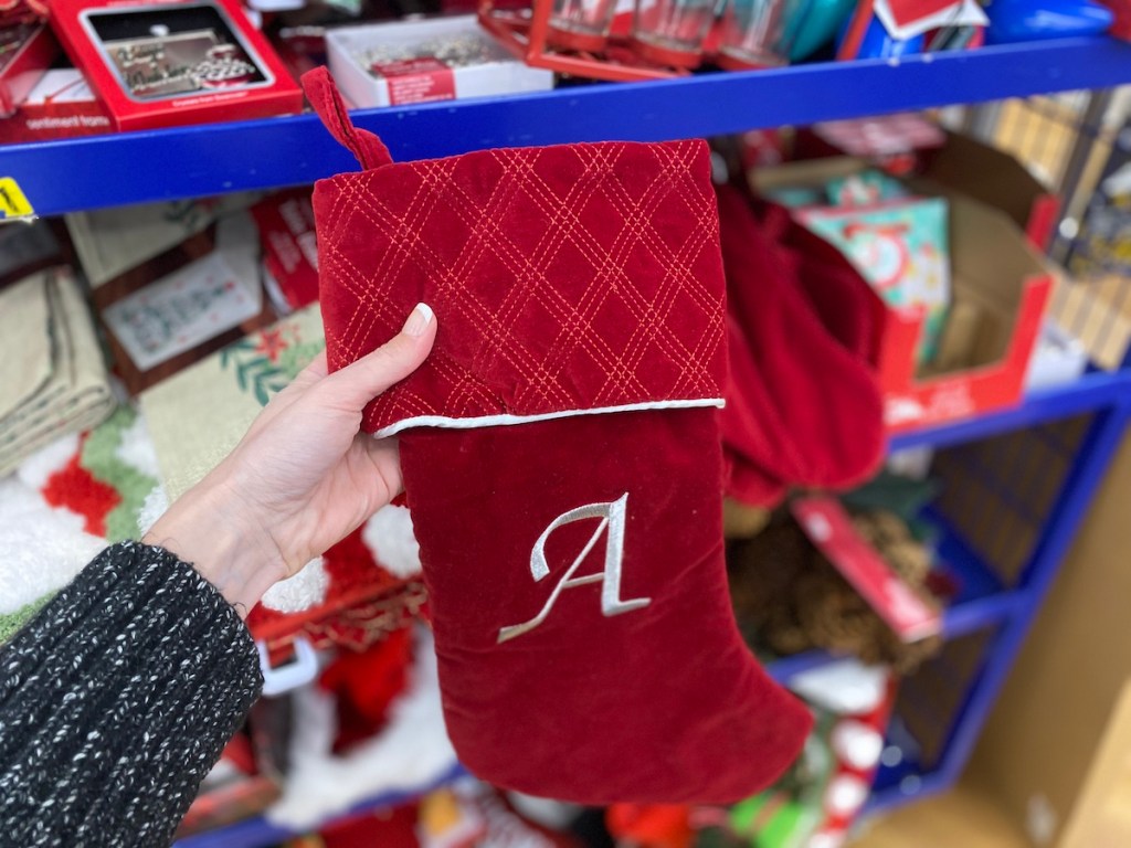 hand holding a Harvey Lewis Monogram Stocking 