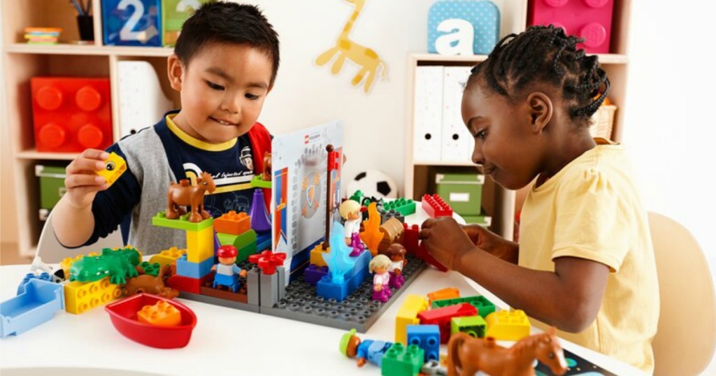 Kids and teacher playing with LEGO Storytales Set