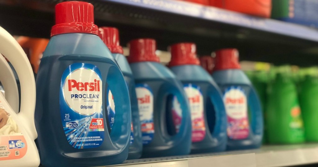 several laundry detergent bottles lined up on a shelf