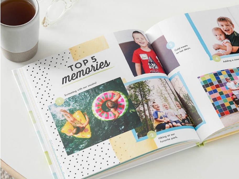 Shutterfly Photo Book open on table next to cup of coffee