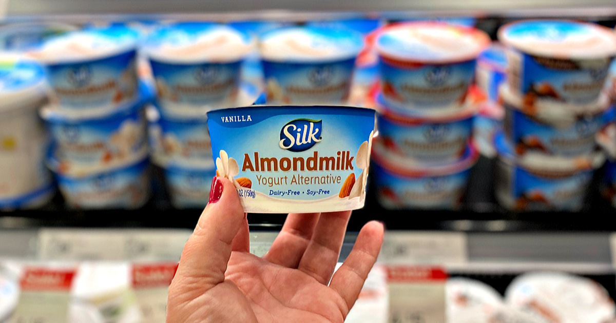 hand holding container of Silk Almondmilk Yogurt in Target