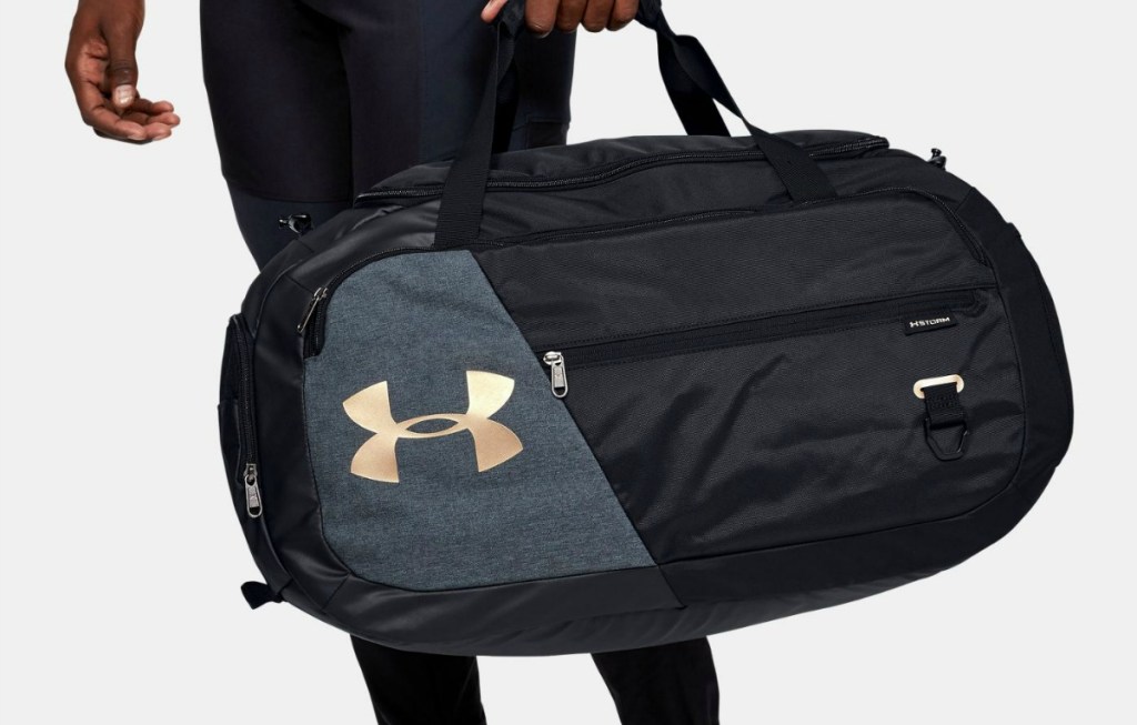 Man carrying Under Armour Duffel