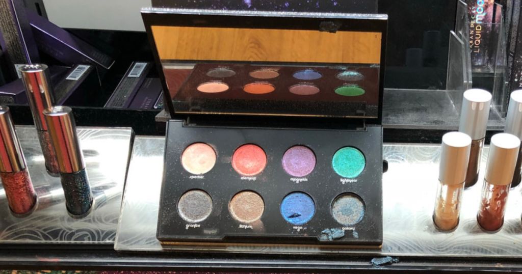 Urban Decay Moondust Eyeshadow Palette on display in store with lip products near by as well