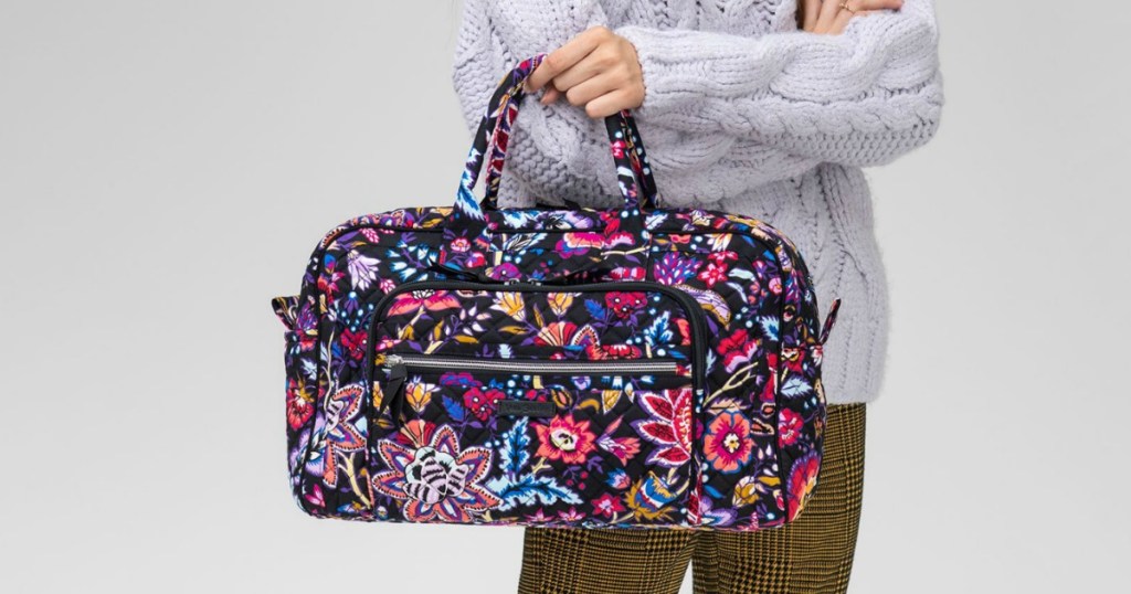 lady holding a Vera Bradley Weekender 