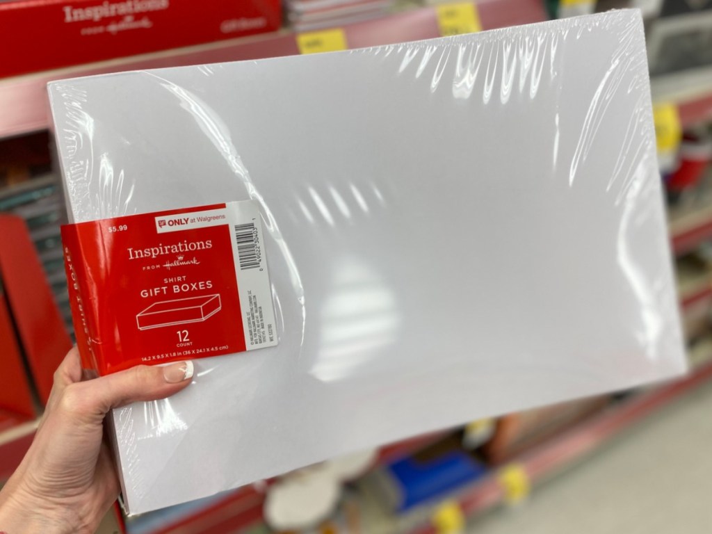 Hand holding Shirt boxes at Walgreens