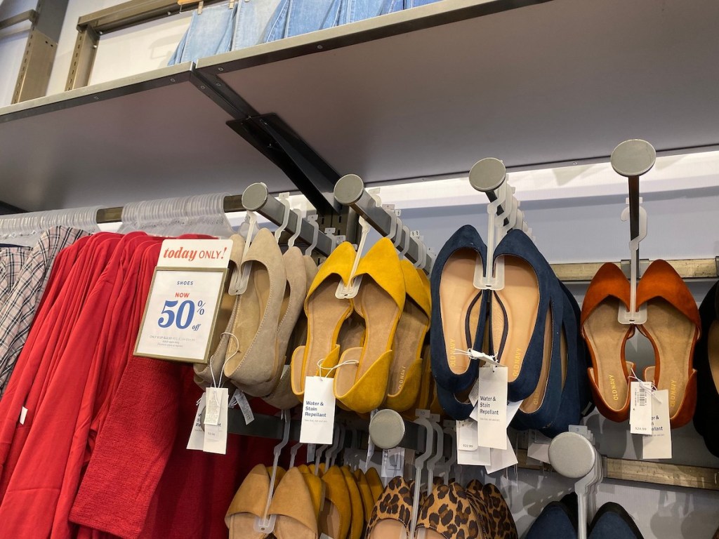 old navy womens slip on dress shoes in navy, yellow, and tan with sale sign in store