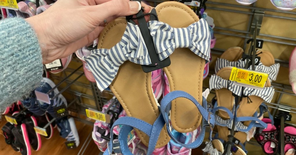 hand holding pair of Wonder Nation Sandals