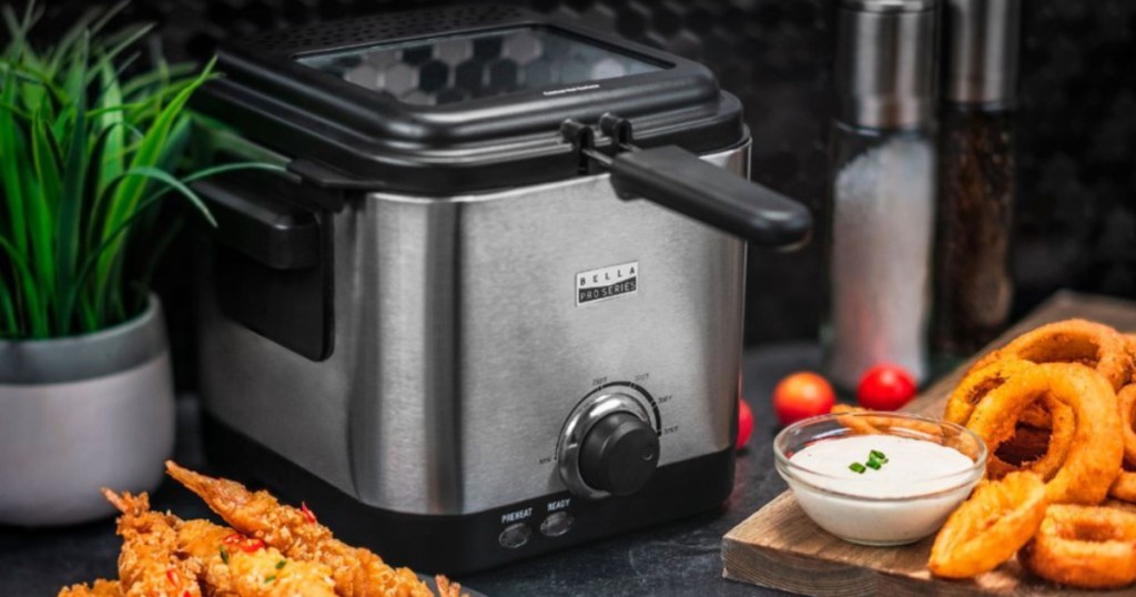 bella deep fryer on counter with fried foods next to it