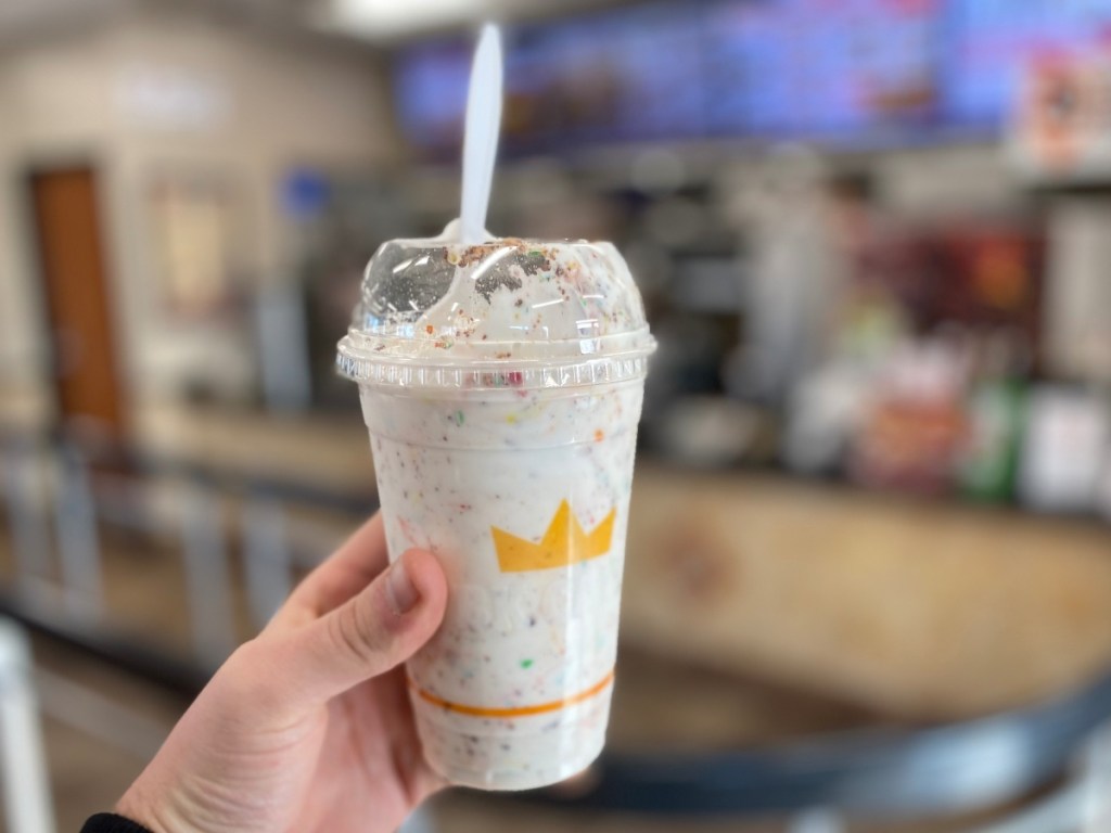 hand holding M&Ms shake at Burger King