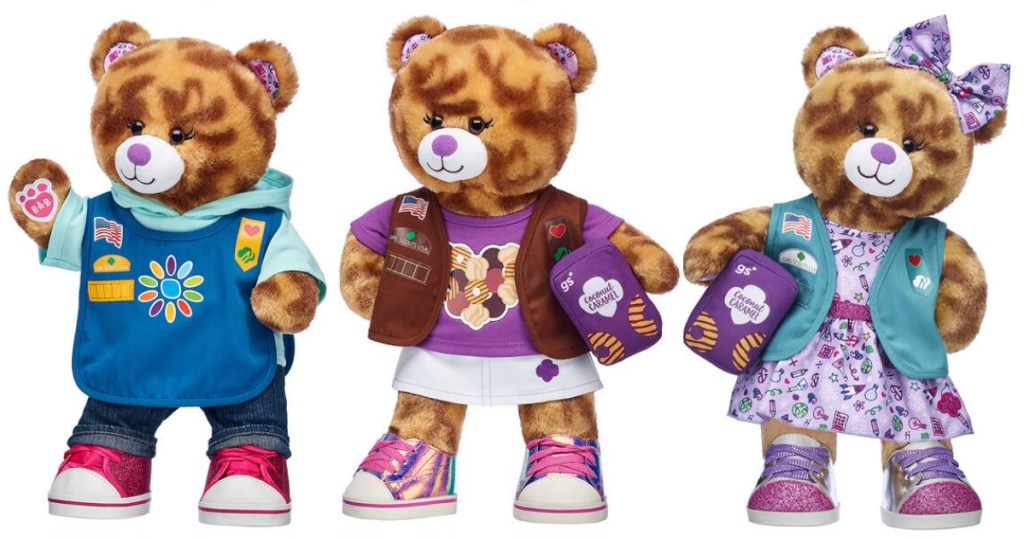 Caramel Cookie bear wearing 3 different Girl Scout uniforms