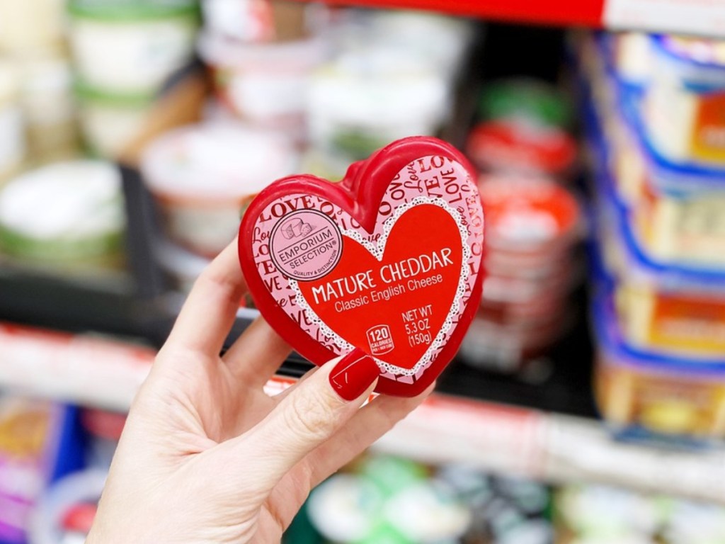 hand holding heart-shaped cheese at ALDI