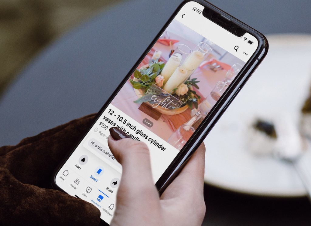hand holding a phone with facebook marketplace listing on screen
