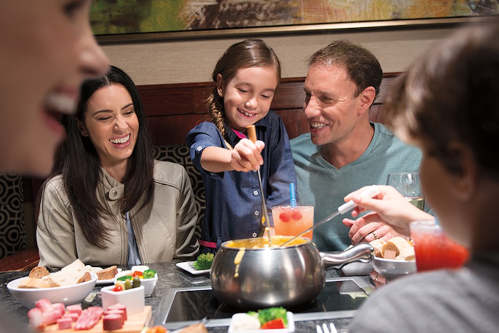 family at the melting pot laughing