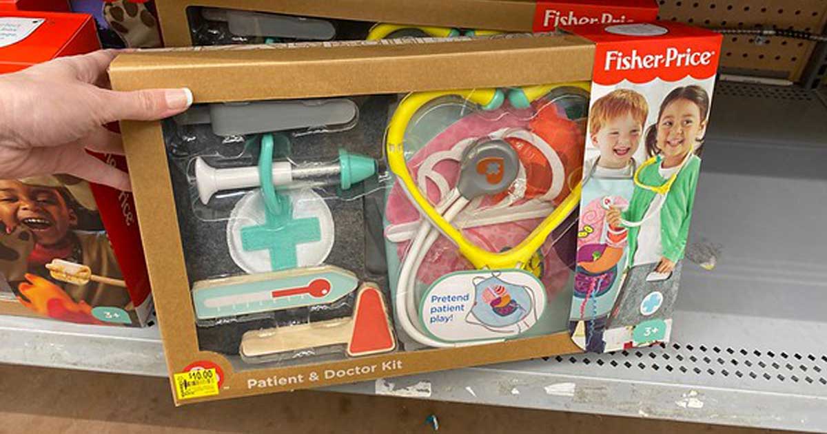 hand holding FIsher Price Patient and Doctor Kit