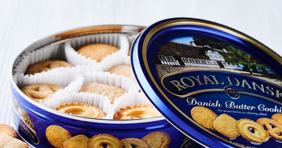 Open tin of Royal Dansk Cookies. Filled with cookies.