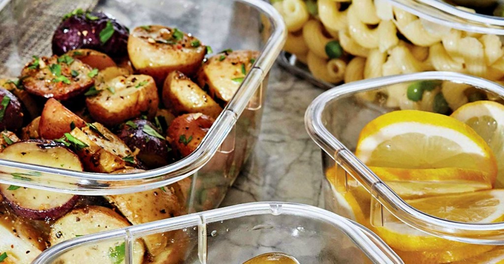 containers with potatoes and lemon slices on table