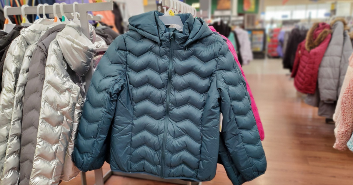 blue puffer jacket hanging in store