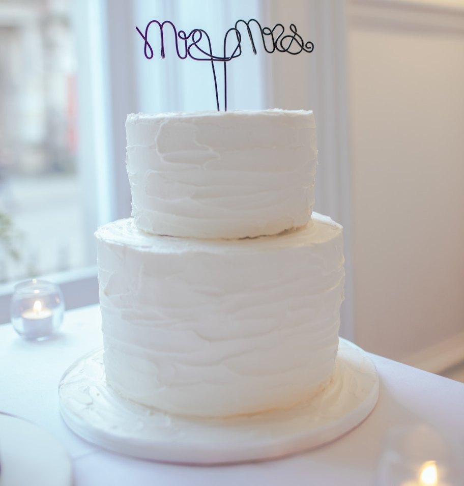 white two tier wedding cake with mr and mrs cake topper wedding ideas on a budget