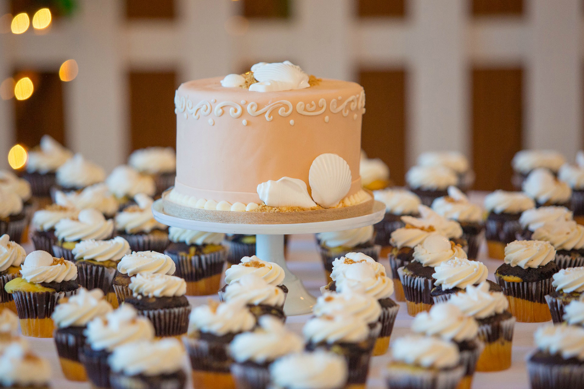 wedding cake with cupcakes