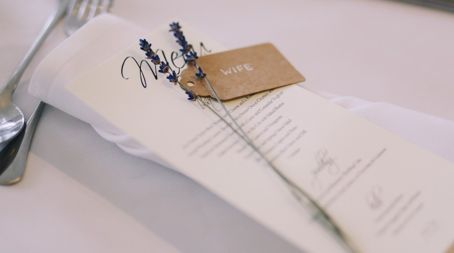 close up of wedding menu stationary on table wedding ideas on a budget