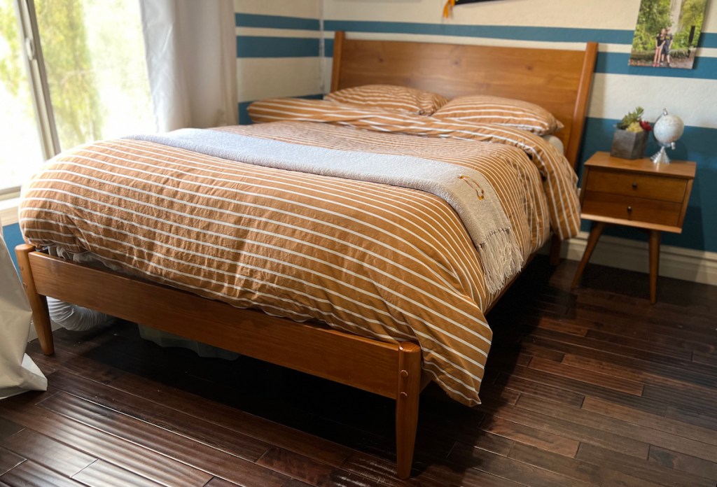 mid century modern wood bed frame and nightstand in boys room