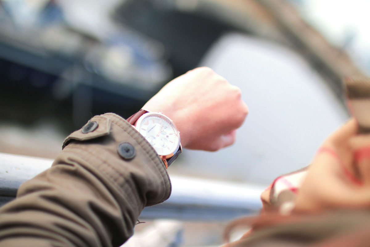 woman looking at watch