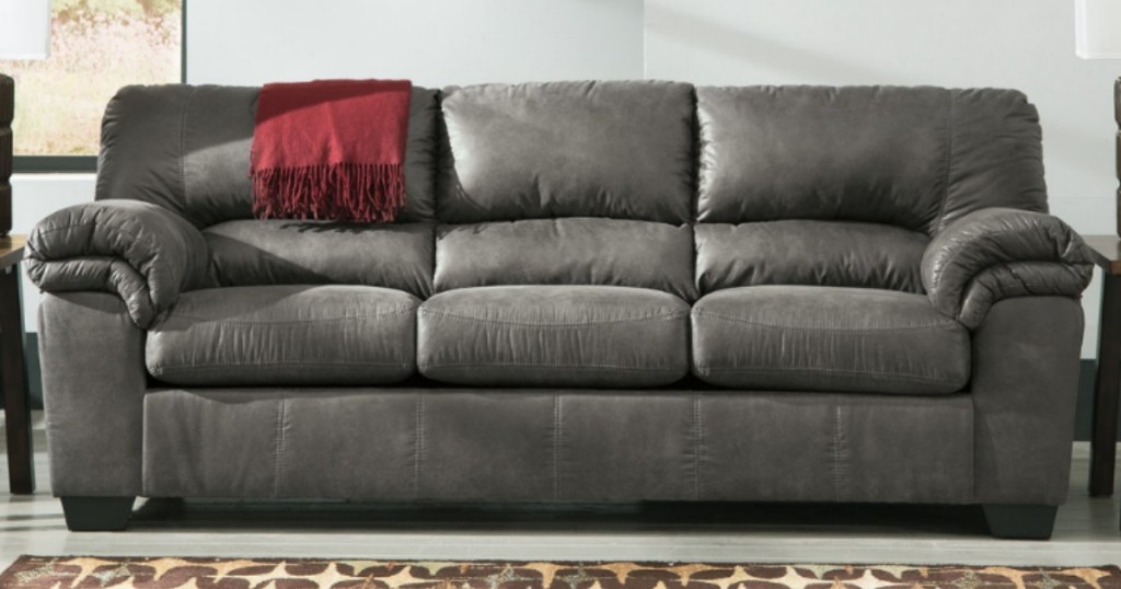 Large dark gray leather sofa in living room 