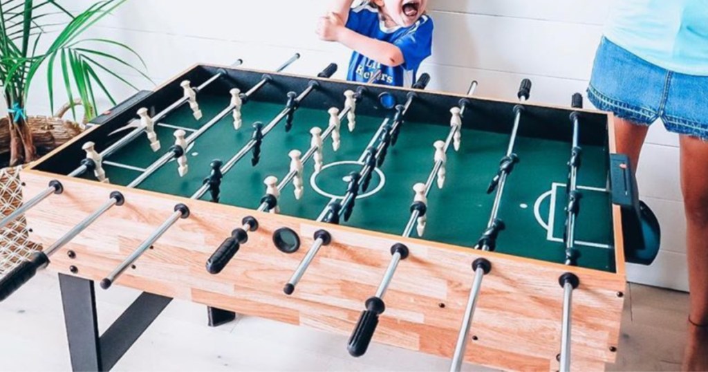 Family playing with game table