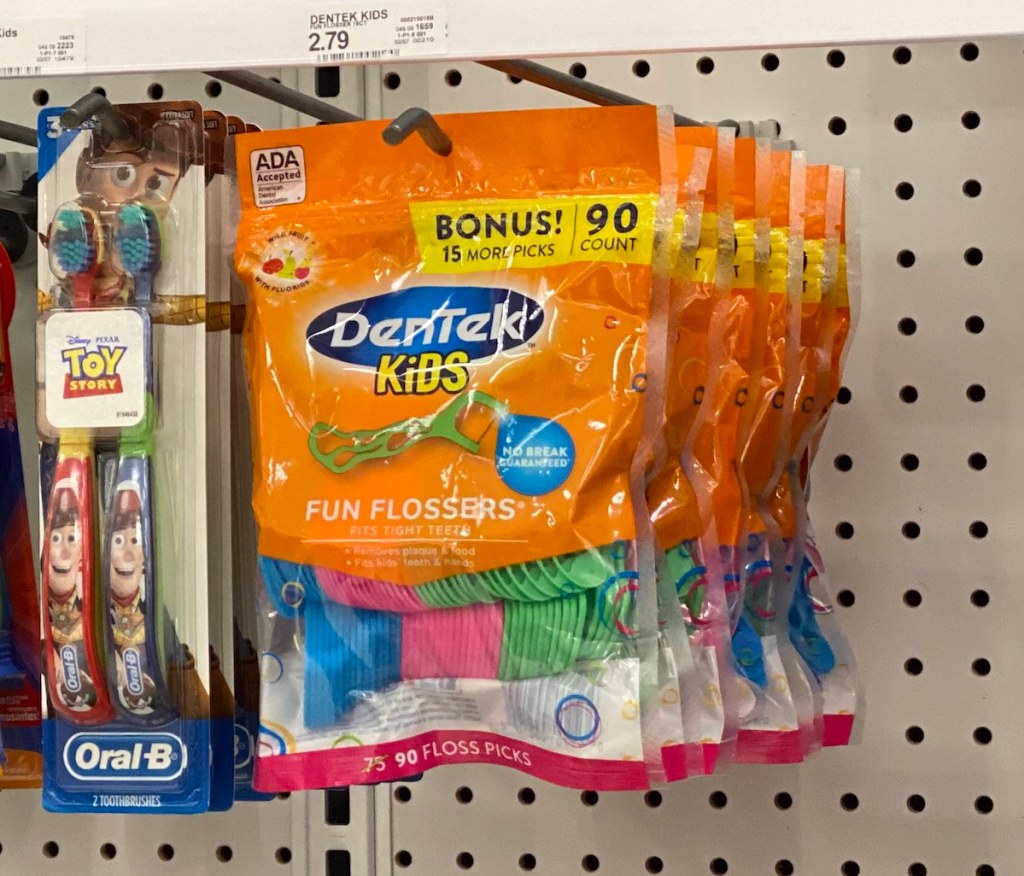 rack with toothbrushes and flossers at Target