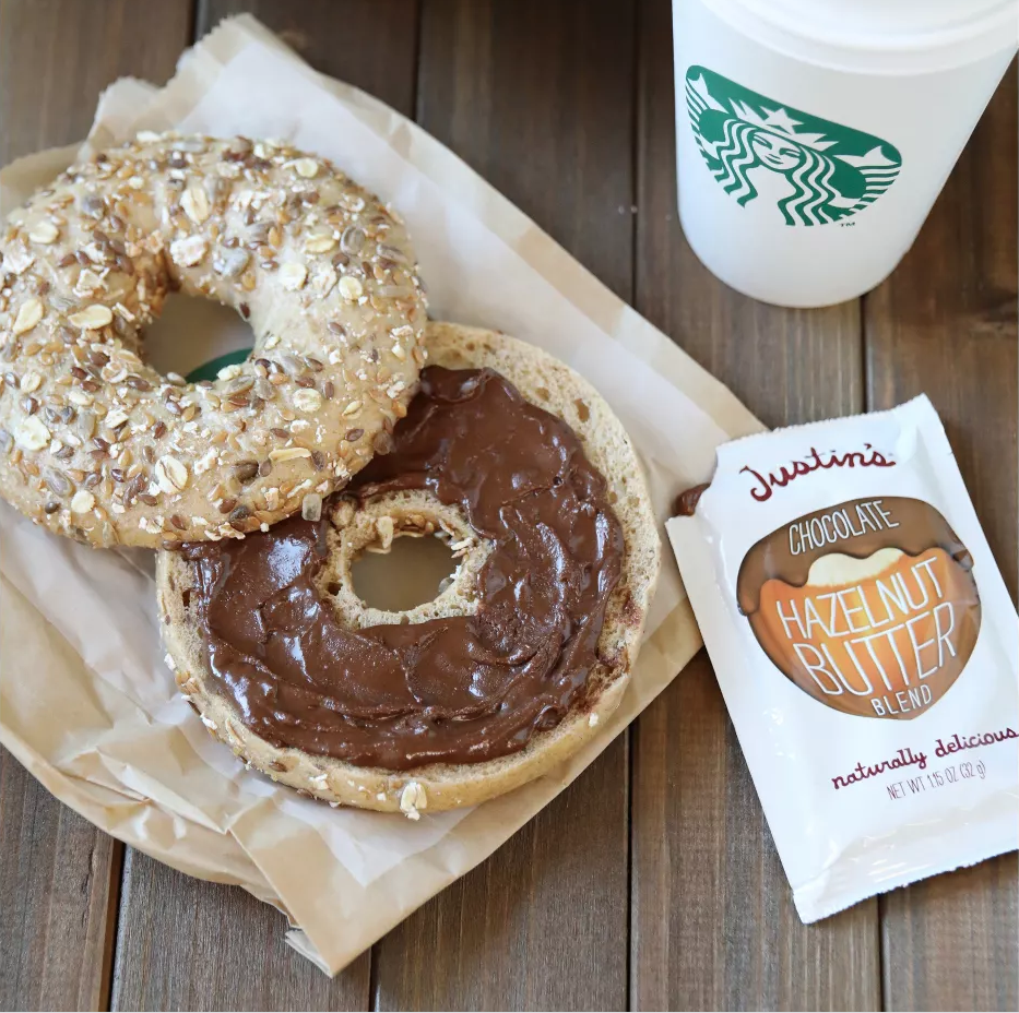 Justin's Hazelnut Butter Blend on table with bagel