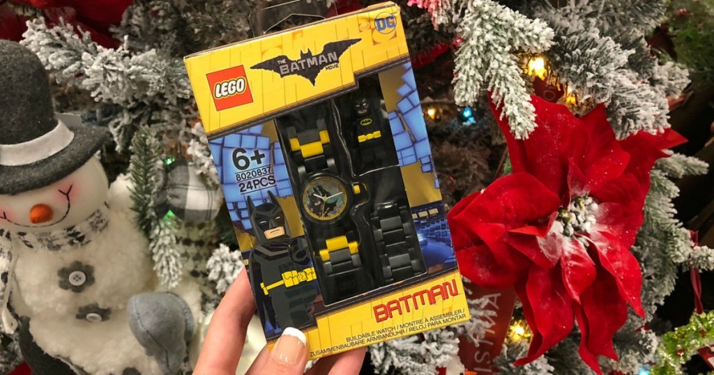 woman holding LEGO Batman watch