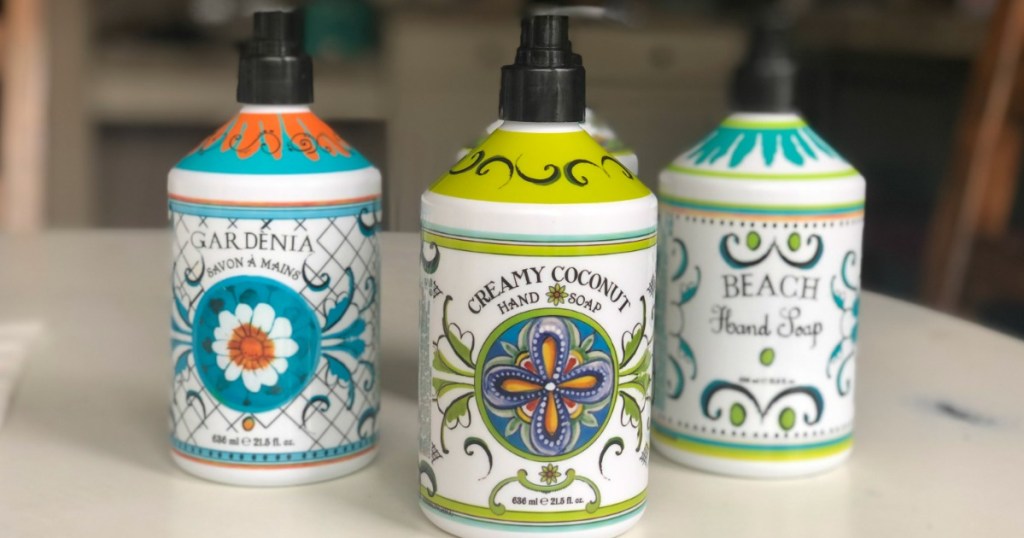 three bottles of soap in pretty bottles