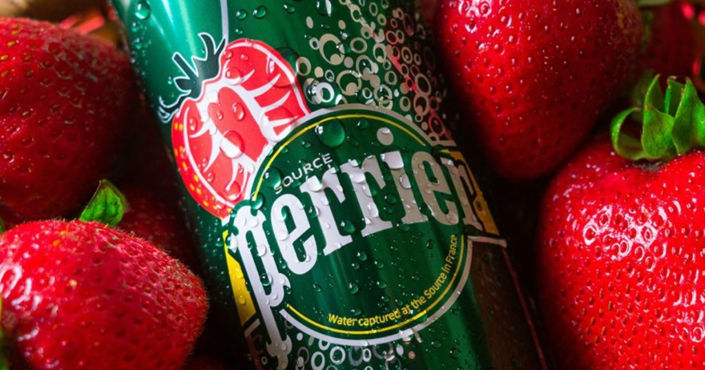 Perrier strawberry beverage can surrounded by strawberries