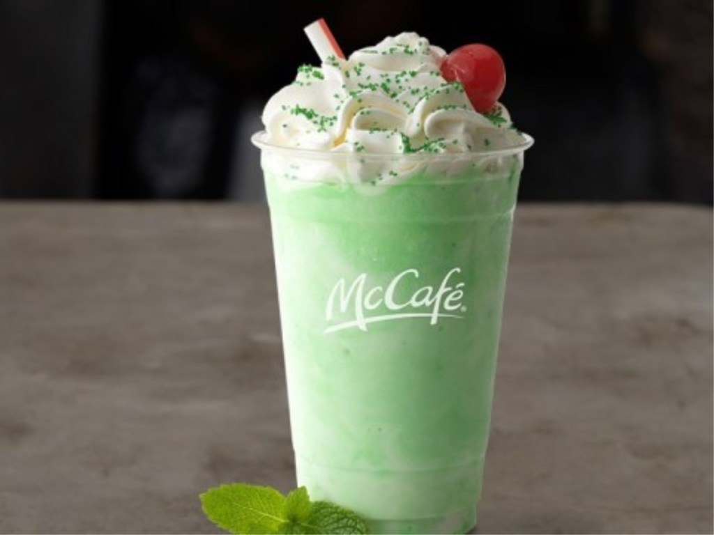 Shamrock Shake with whipped cream, green sprinkles, and cherry