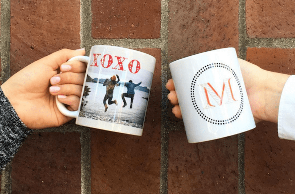 people holding photo mugs