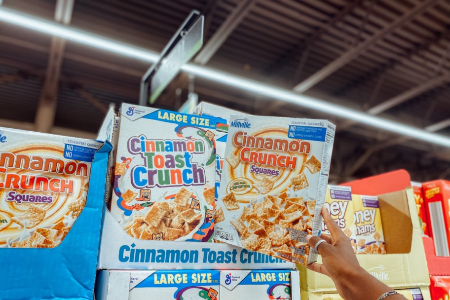 Box of store brand ALDI cereal next to General Mills cereal box