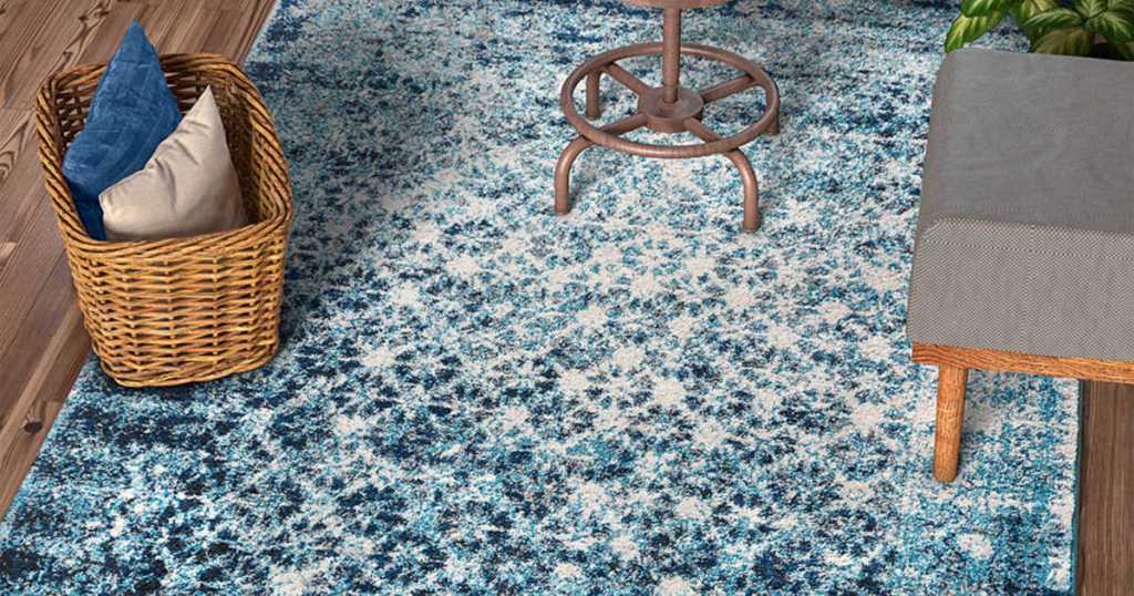 blue, light blue, and white rug with chair and basket on top