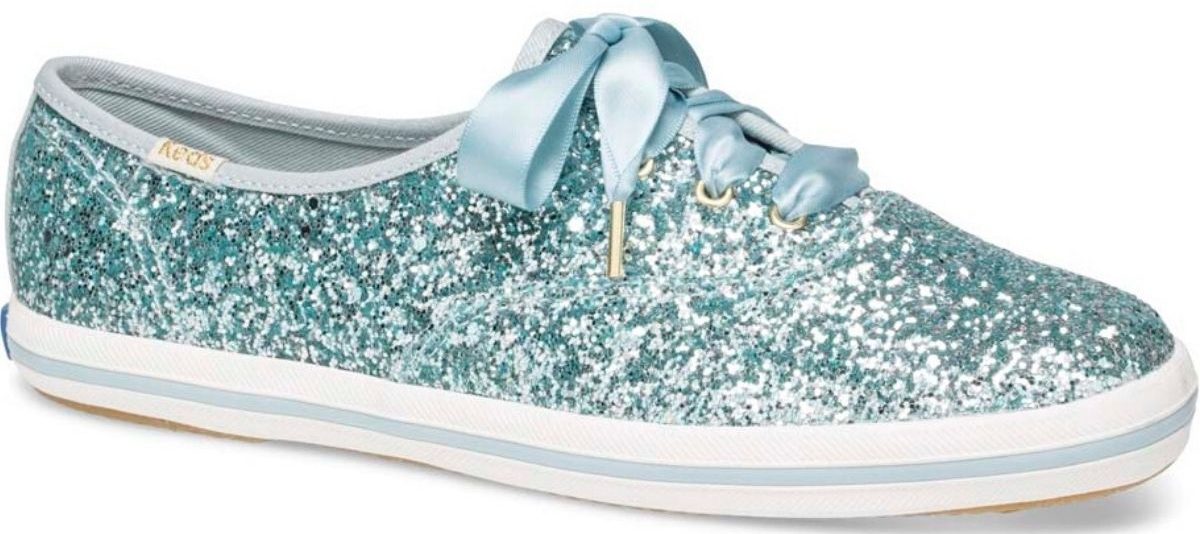 woman's right foote glitter tennis shoe