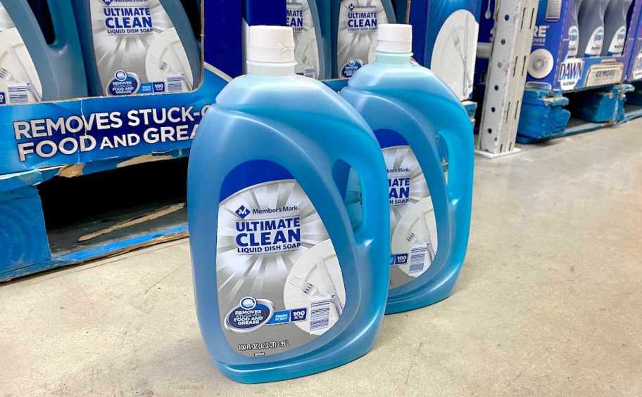 two bottles of blue dish soap on store floor