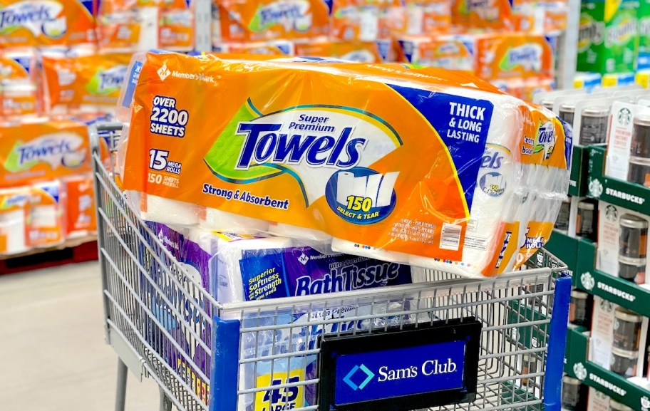 sams club cart in store aisle with paper towels stacked on top