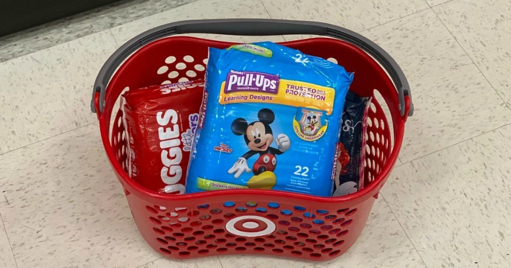 diapers in a store basket displayed on the floor