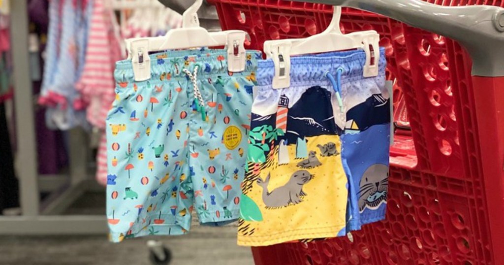 boys swim trunk hanging on a store shopping cart