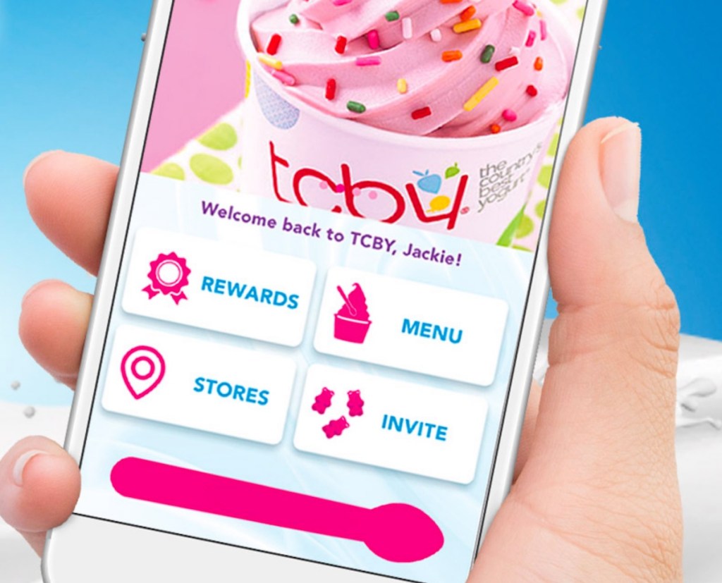 hand holding phone with tcby app