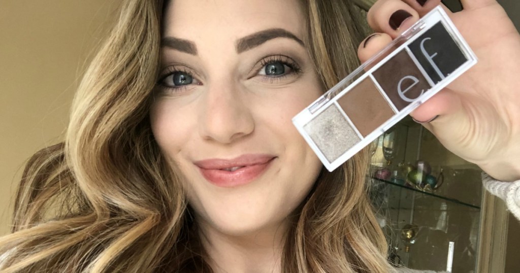 woman holding elf cosmetics eyeshadow pallete